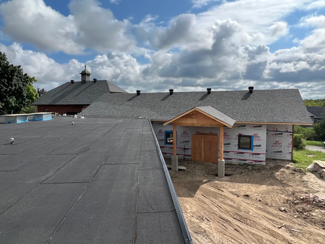 Commercial flat roof and new addition
